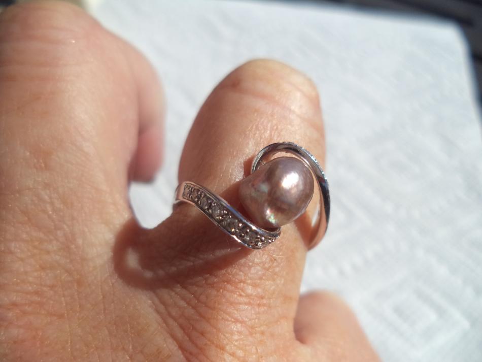 Wearing wild-caught, natural pearl set into ring: Pearl Paradise