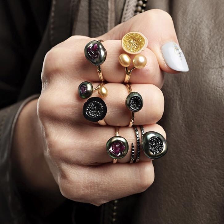 A fistful of little h pearl geode rings