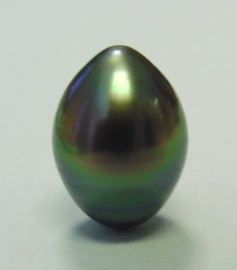 Intense peacock pearl shaped like a football