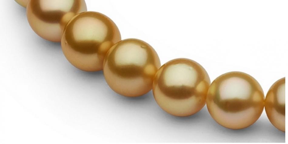 Pearl Paradise sale arrived today.  Eighteen inches of 22 kt deep golden color with green overtones, drop shape, 9-11mm close up