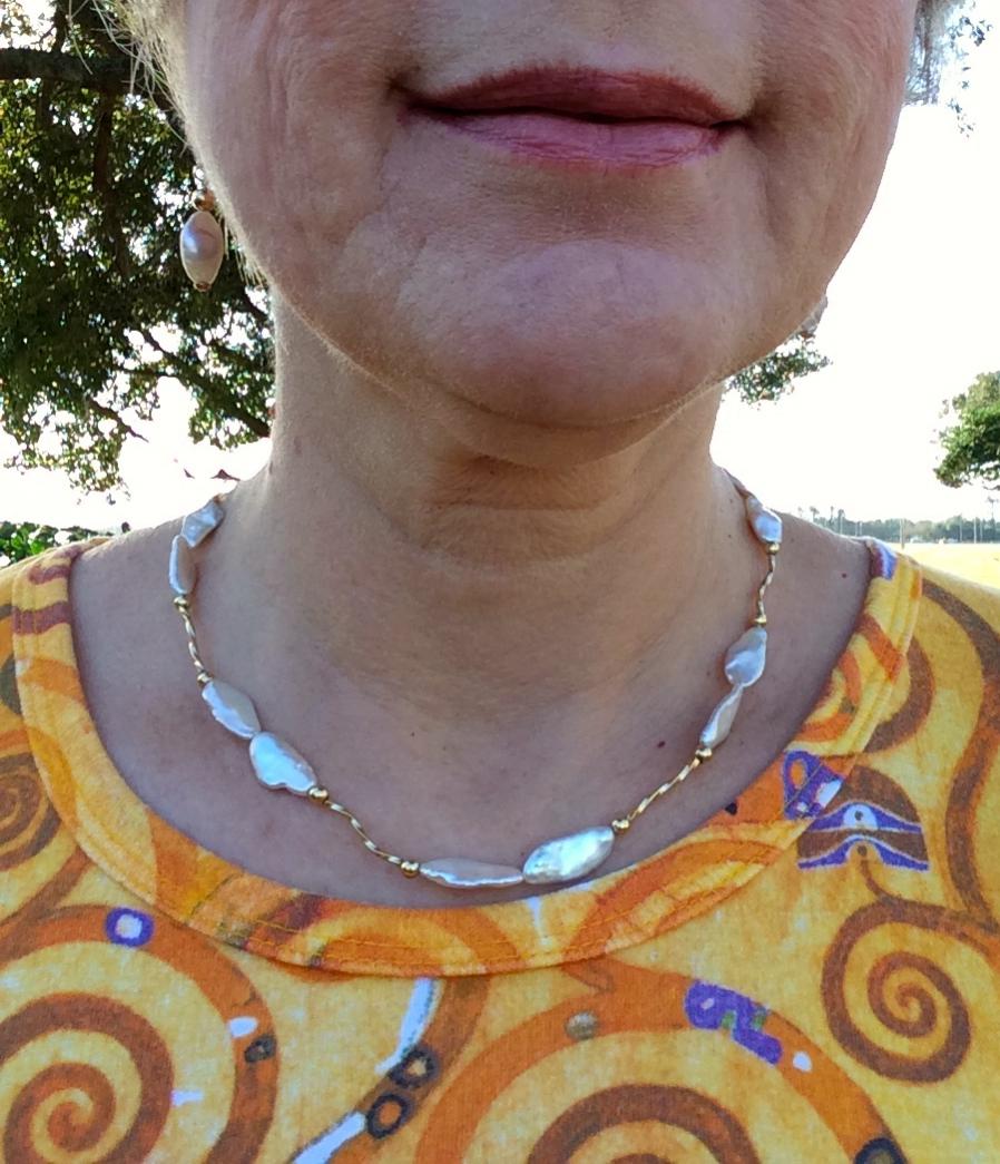 Reborn pearl tin cup with squiggle gold bugle beads, and matching drop earrings