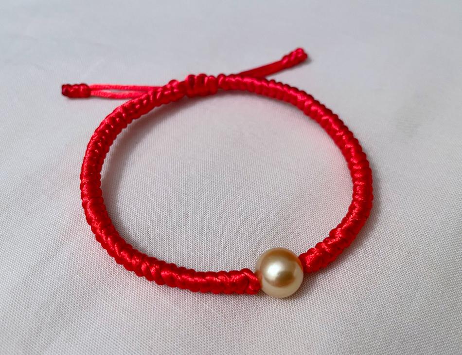 golden south sea pearl in braided bracelet