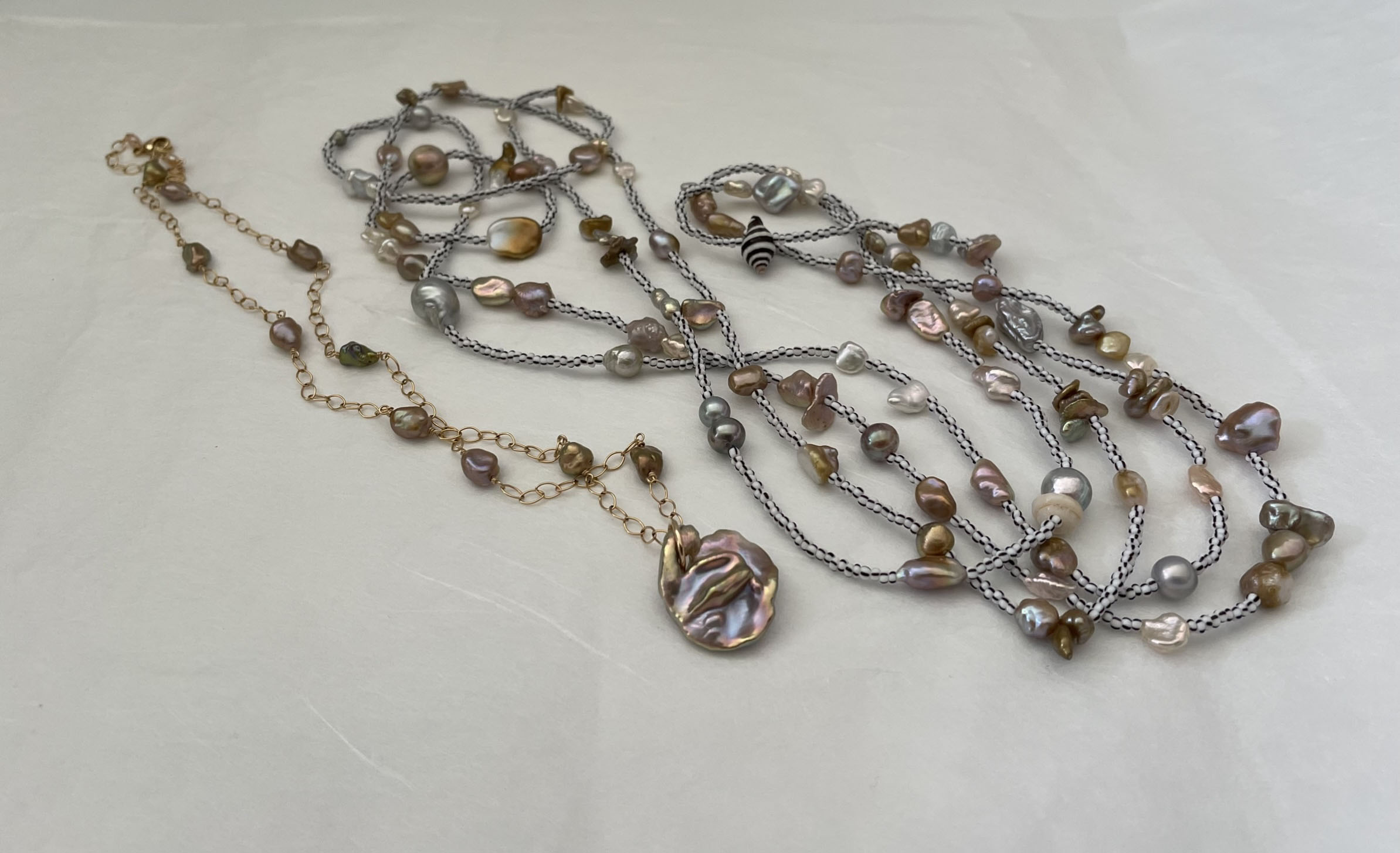 These two lengths are a mix of beads, shells and pearls. I made the short necklace with pearls I bought at the first PBTB