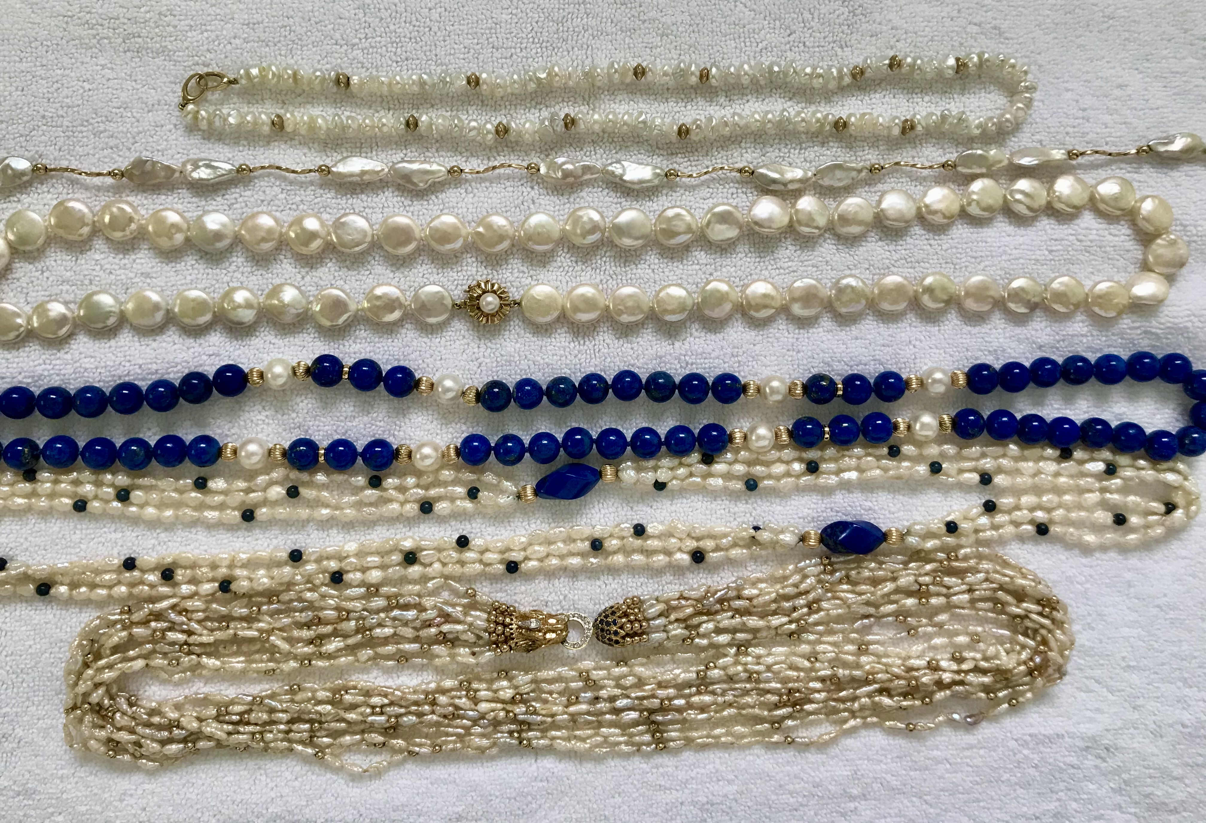 Freshwater keshi Kojima.  Reborn pearls (keshi)  store in Mt. Dora, FL.  Coin pearls from Karen Brown Jewelry.  Mom's lapis lazuli bead necklace.  I replaced the small, dull akoya pearls with larger Freshadamas from Pearl Paradise, and now I love the necklace.  Mom's 3 strand Rice Krispies with lapis beads.  Mom's 12 strand, pink Rice Krispies torsade with dragon head clasp.