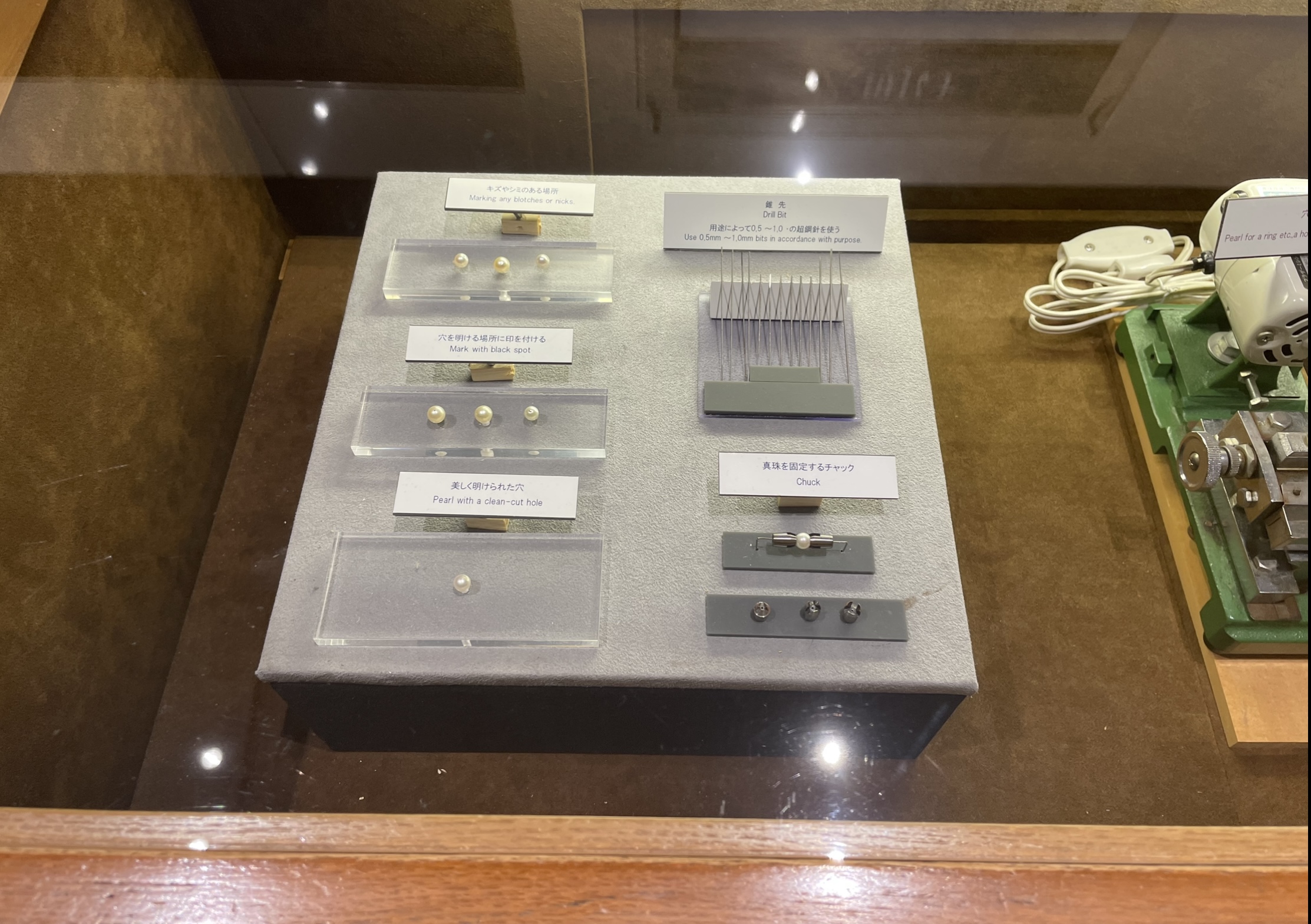 Drilling akoya pearls - Mikimoto Pearl Museum