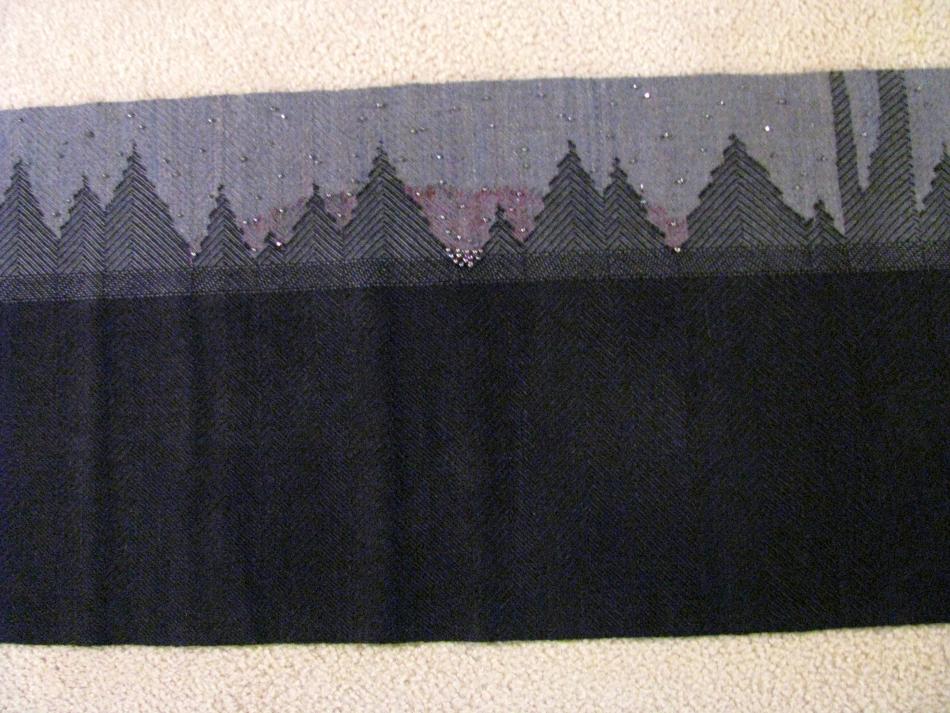 shawl with long fringe covered in crystals and pearls