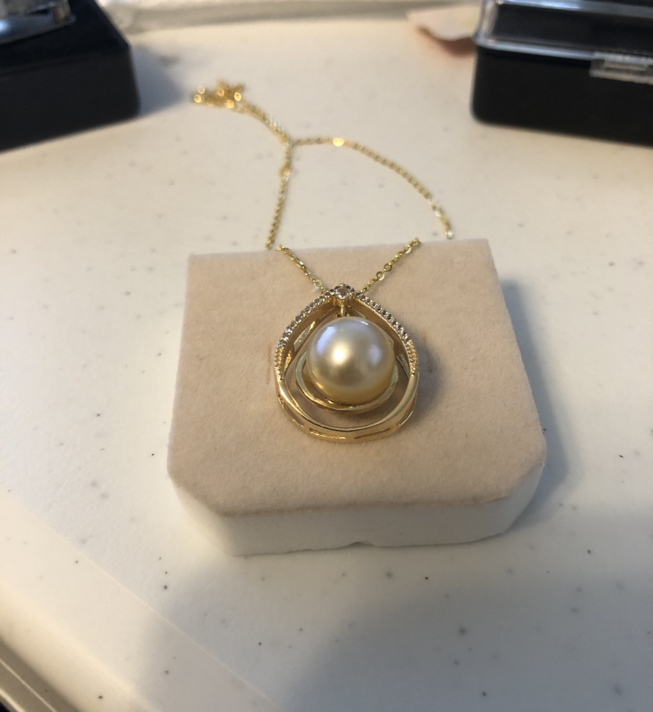 Etsy: Sold as golden south sea pearl in a gold plated sterling silver pendant with cubic zirconia