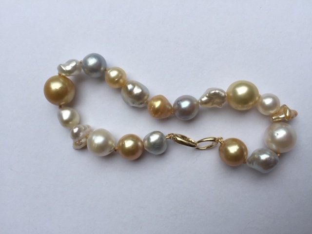 Pearl Paradise gold and white South Sea round, baroque and keshi bracelet
