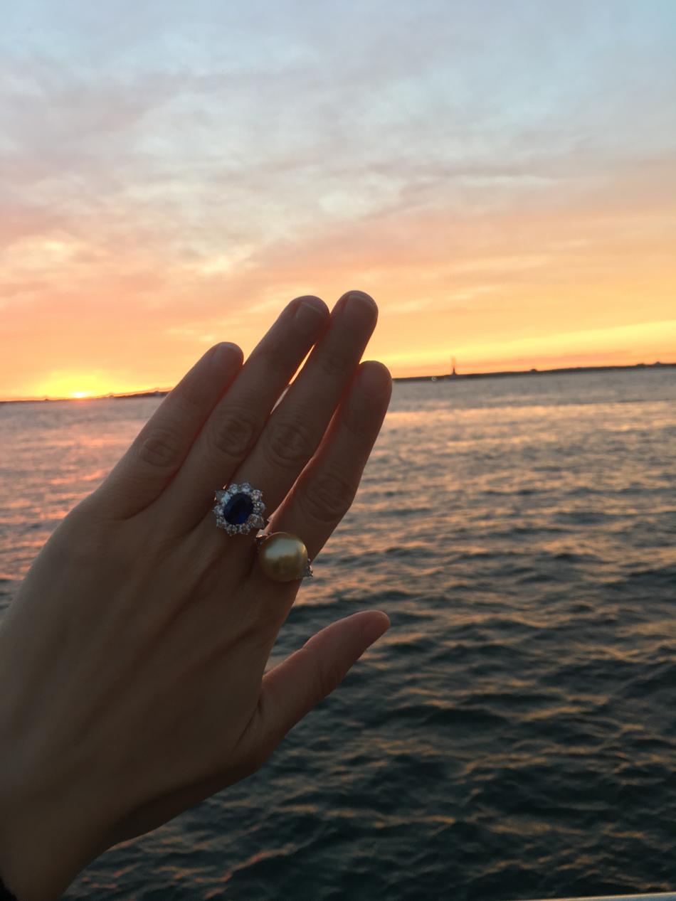 GSSP and Sapphire rings with cotton candy colored sunset and Lady Liberty in the background