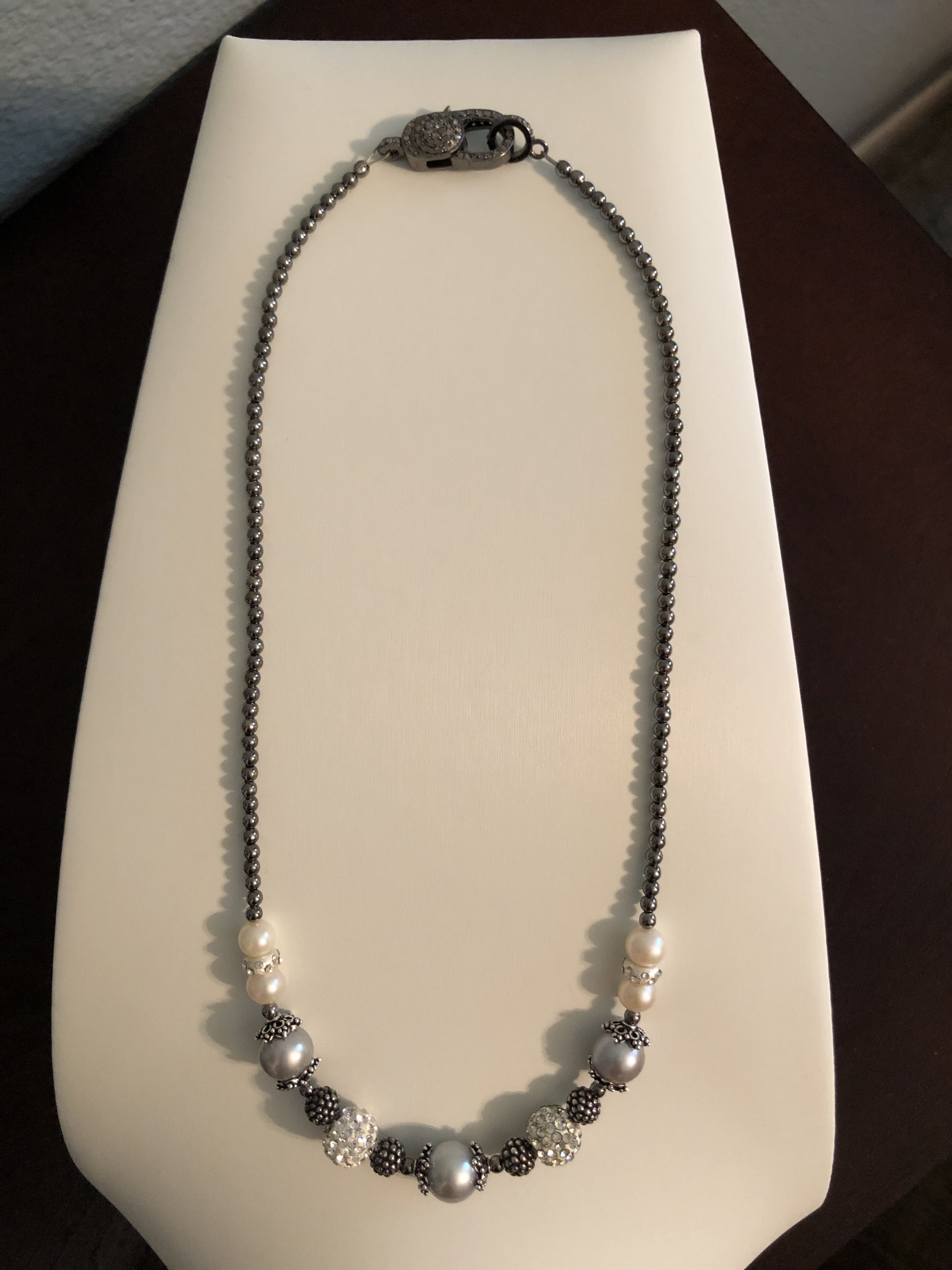 a necklace containing the sparkly larger beads and the gunmetal smaller beads - Kohls