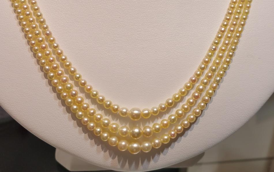 KC Bell: Triple strand natural pearls