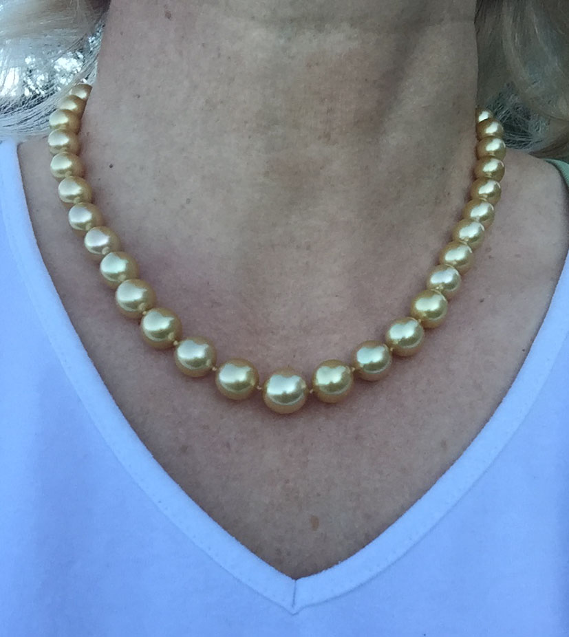 golden pearls worn in evening light