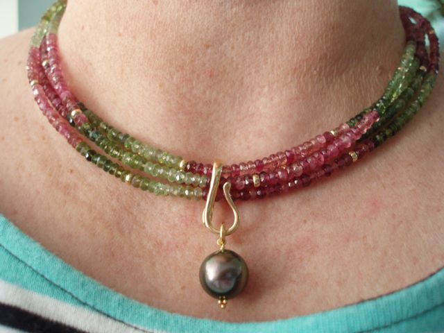 pink and green tourmalines I strung a few years ago, an enhancer finding and a Tahitian pearl
