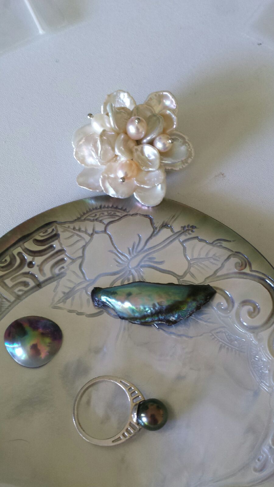 A ring from Kamoka and the shell, Sea of Cortez mabe and abalone pearl from Douglas, flower brooch from Kojima