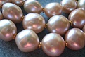 Close Up Of Large Peach Baroque Freswater Pearls With 14 Carat Gold Accent Beads