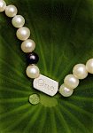 "One World" pearl necklace on lotus leaf