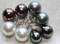 Intense peacock Tahitian earrings from TahitianPearls.biz. 
Silver/Gray Tahitian earrings from Pear