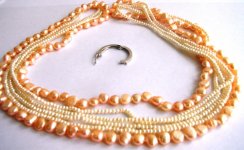 Peach button pearls entwined with white seed pearls gallery 3.JPG