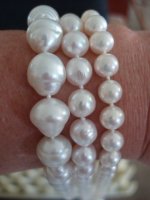 3 white pearls on wrist- SSP, baroque akoya, metallic white FWP.jpg