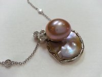 stunning use of freshwater cultured pearls and diamonds