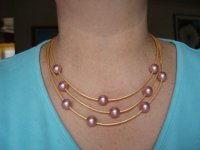 Swarovski imitation pearl and metallic leather necklace.jpg