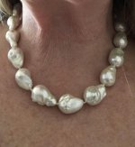 Today I have on a strand of white freshwater fireball pearls.  I had on a white blouse but took it off to better see the pearls