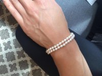 Playing with some freshwater pearls worn as bracelet