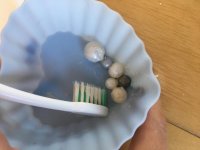 The silver paste gets a bit dry over time - reconstitute with droplets of water, scrub up some bubbles and scrub onto silver/pearls