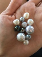  It's just water droplets on the pearls.  I rotated the pearls around to capture all facets