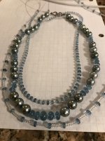 Restringing pearls with aquamarine stones