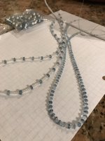 Restringing pearls with aquamarine with white topaz 