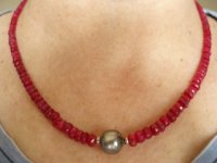Ruby beads Tahitian necklace under tungsten lights.jpg