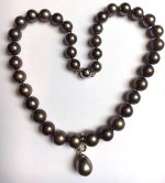 aroque Tahitian pendant also shows coppery brown tones. The pearls are 10-12mm