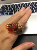 Fire opals as the petals and multicolor sapphires on the rest of the ring