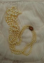 golden triple akoya necklace with a gold and citrine clasp