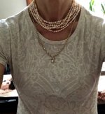 Wearing 100 inch rope of un-knotted tiny pearls