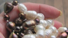 pearl necklace operate 70 w bronze holding close good.jpg