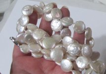 pearl necklace coing holding.jpg