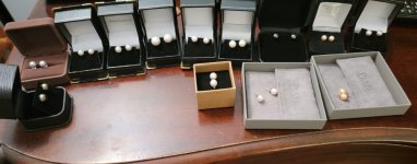 All of my pearl earring collection in boxes