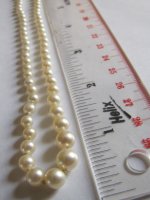 pearl necklace 14k gold clasp rectangle with pearl with ruler close.JPG