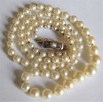 pearl necklace 14k gold clasp rectangle with pearl on paper good 2.JPG