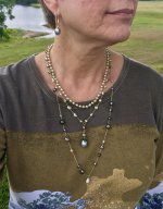 Photo taken outdoors: Pistachio akoyas from Pearl Paradise and the Tahitian tin cups and freshwater drop earrings from Kojima
