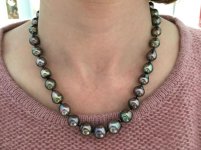 Wearing Pearl Paradise cherry peacock Tahitian strand with pink sweater
