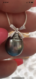  I'm uncertain whether it's a dyed freshwater pearl or a genuine Tahitian pearl