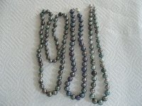 Comparing dyed FWP and 2 Tahitian strands forum.jpeg