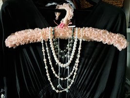 Store, display pearl strands.jpg