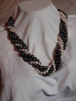 Five strand torsade - freshwater cultured pearls (some dyed) on Dandyline with sterling silver.jpg