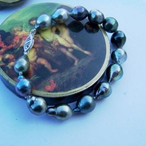 A very colorful, very unique drop and baroque Tahitian pearl bracelet.  One of the pearls is actually pink and purple.