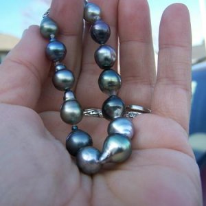 This is a very colorful Tahitian pearl bracelet with unique drop and baroque shapes.  One pearl is actually pink and purple! (pic2)