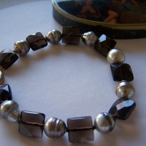 Silver and chocolate striped Tahitian Pearl bracelet with faceted smokey quartz.
